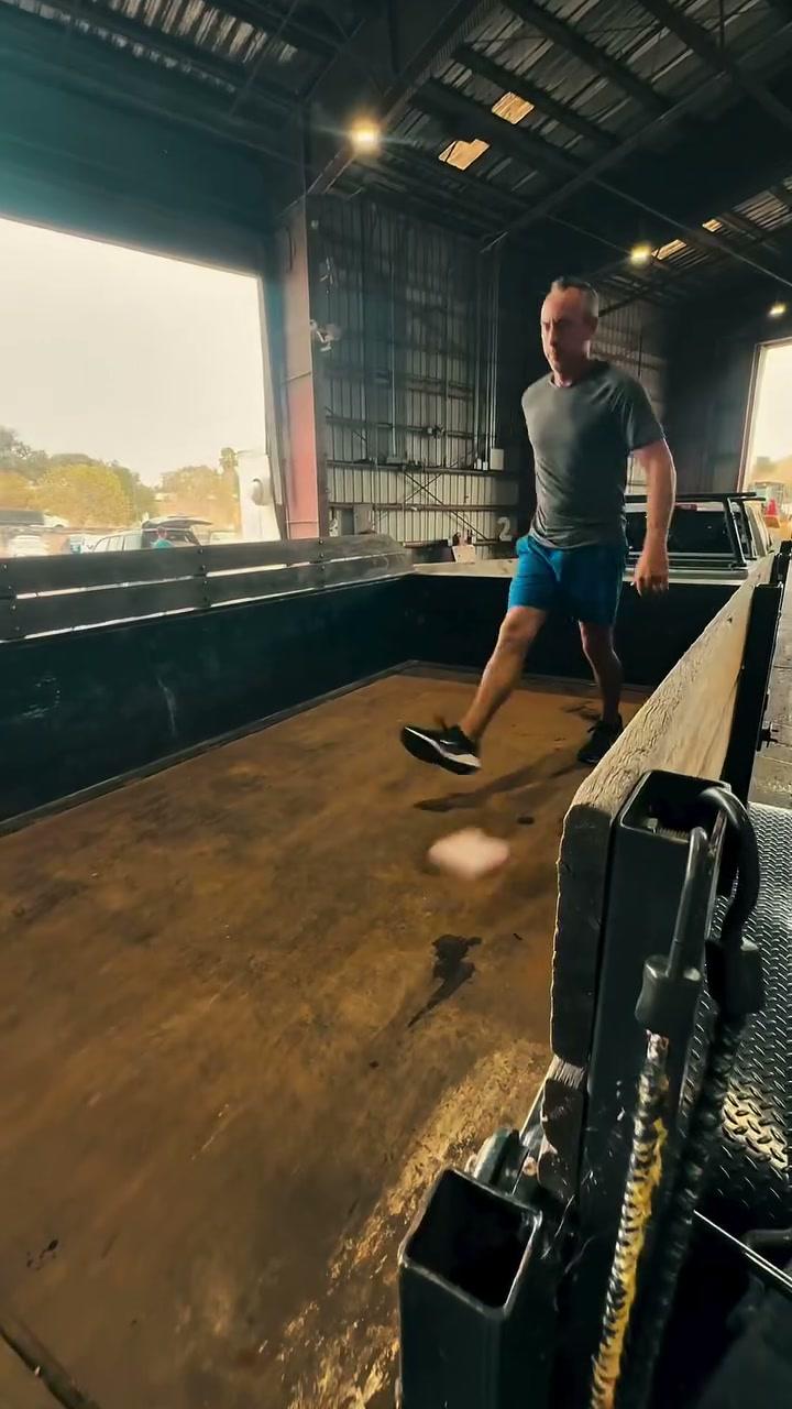 Walking through the empty bin trailer inside the transfer station